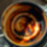 A close-up of a burnt pot interior with residue and stains