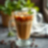 Chilled coffee served in a clear glass with a sprig of mint
