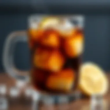 A close-up of cold brew coffee with ice cubes and a slice of lemon