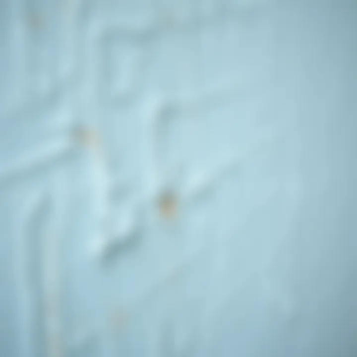 Close-up of light blue paint texture on a wall