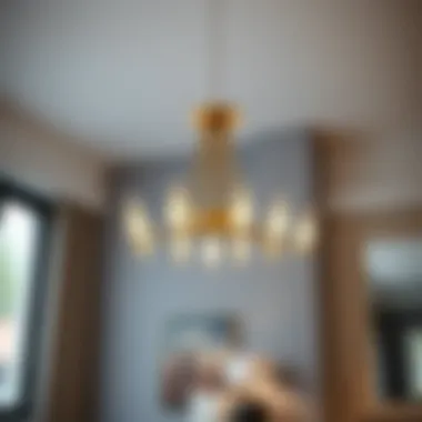 Minimalist chandelier with sleek lines and metallic finish.