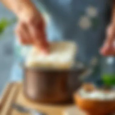 Scrubbing Techniques for Burnt Cookware A hand scrubbing a pot with a cleaning pad and detergent